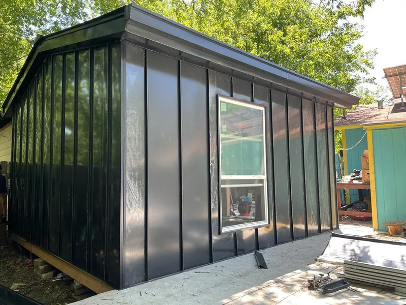 Black standing seam metal wall panels for Metal Roof Installation in North Liberty