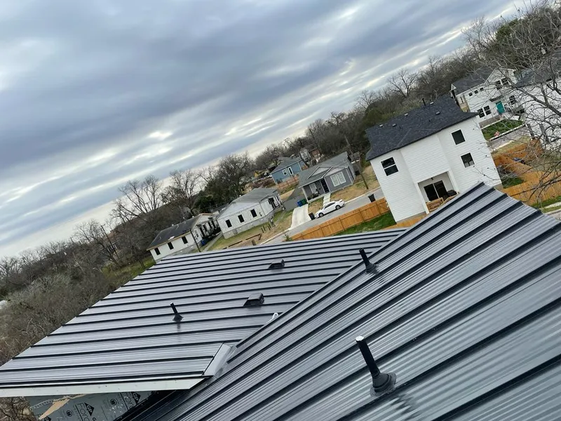 Standing seam metal roof panels with vents for Skylight Repair in North Liberty